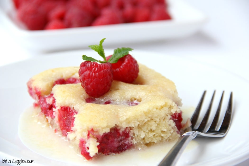 Warm Raspberry Cake with Vanilla Glaze - just like your mom used to make! A delicious cake with fresh raspberries baked in and topped with a sweet vanilla glaze!