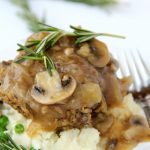 Easy Salisbury Steak with Mushroom Gravy - This homemade salisbury steak incorporates mushrooms and onions right into the beef patties!