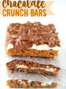 Chocolate Crunch Bars - These bars have a cake-like crust with a gooey marshmallow center and chocolate peanut butter krispie frosting!
