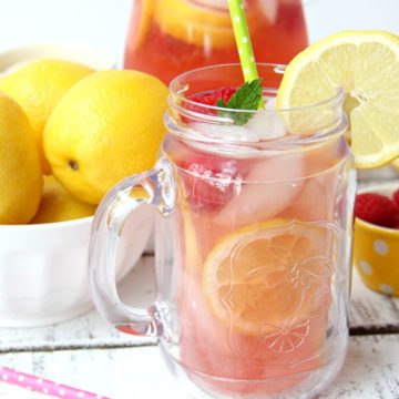 Pink Lemonade - Homemade pink lemonade made with fresh raspberries and lemons! So easy and so refreshing and delicious for a baby shower, summer party or picnic!