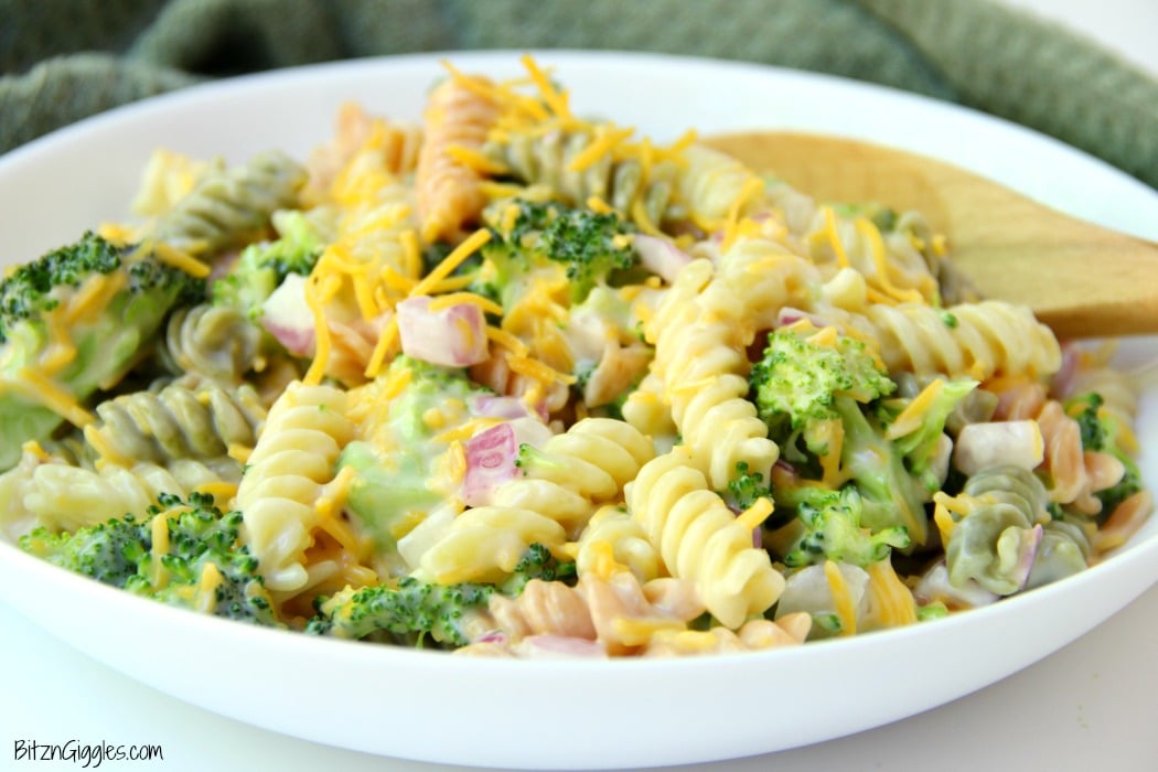 Cheddar Broccoli Pasta Salad - Broccoli, red onion, shredded cheese and rotini pasta tossed in a sweet, creamy dressing! Everyone always asks for seconds!