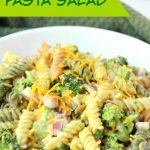 Broccoli Cheddar Pasta Salad - Broccoli, red onion, shredded cheese and rotini pasta tossed in a sweet, creamy dressing! Everyone always asks for seconds!