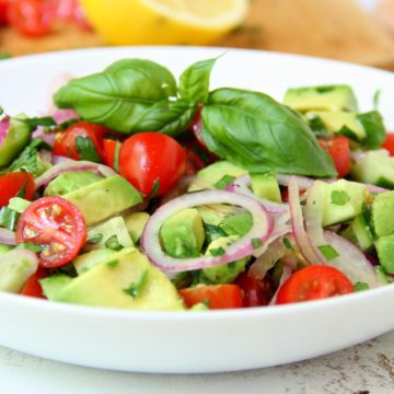 Avocado Salad - A healthy and colorful salad featuring avocado, tomato, cucumber, basil and a splash of lemon!
