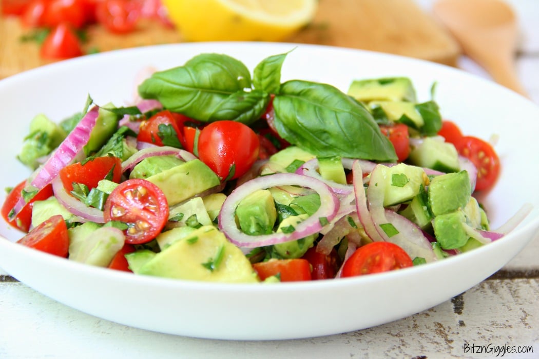 Avocado Salad - A healthy and colorful salad featuring avocado, tomato, cucumber, basil and a splash of lemon!