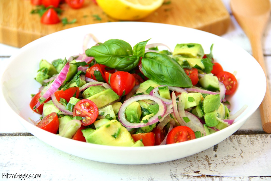 Avocado Salad - A healthy and colorful salad featuring avocado, tomato, cucumber, basil and a splash of lemon!