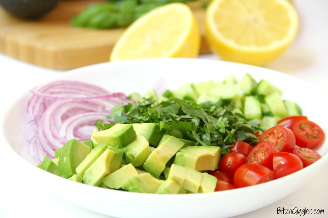 Avocado Salad - A healthy and colorful salad featuring avocado, tomato, cucumber, basil and a splash of lemon!