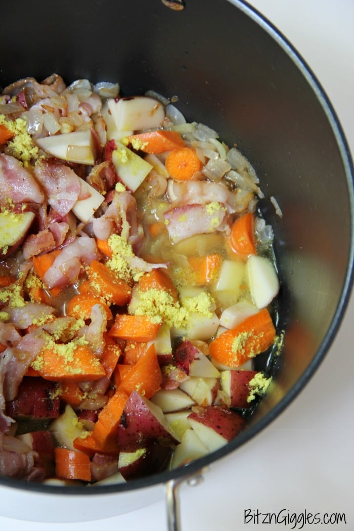 Potato Corn Chowder - Just like Grandma used to make! This flavorful combination of potatoes, corn, carrots and bacon in a creamy, cheesy broth is perfect for the whole family!