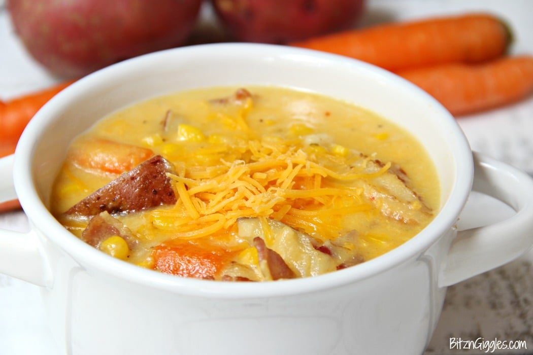 Potato Corn Chowder - Just like Grandma used to make! This flavorful combination of potatoes, corn, carrots and bacon in a creamy, cheesy broth is perfect for the whole family!