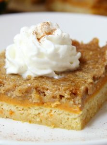 Pumpkin Pie Cake Bars - Three-layer pumpkin bars that come together with a cake mix! Cake batter crust, creamy pumpkin center and a cinnamon sugar crumble topping!