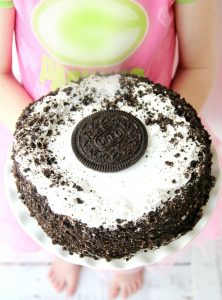 Oreo Ice Cream Cake - A delicious dessert that tastes homemade. Slip onto a cake stand and you're ready to party!