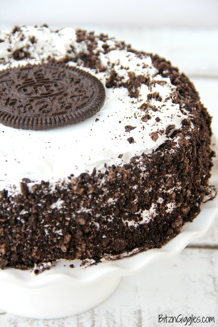 Oreo Ice Cream Cake - A delicious dessert that tastes homemade. Slip onto a cake stand and you're ready to party!