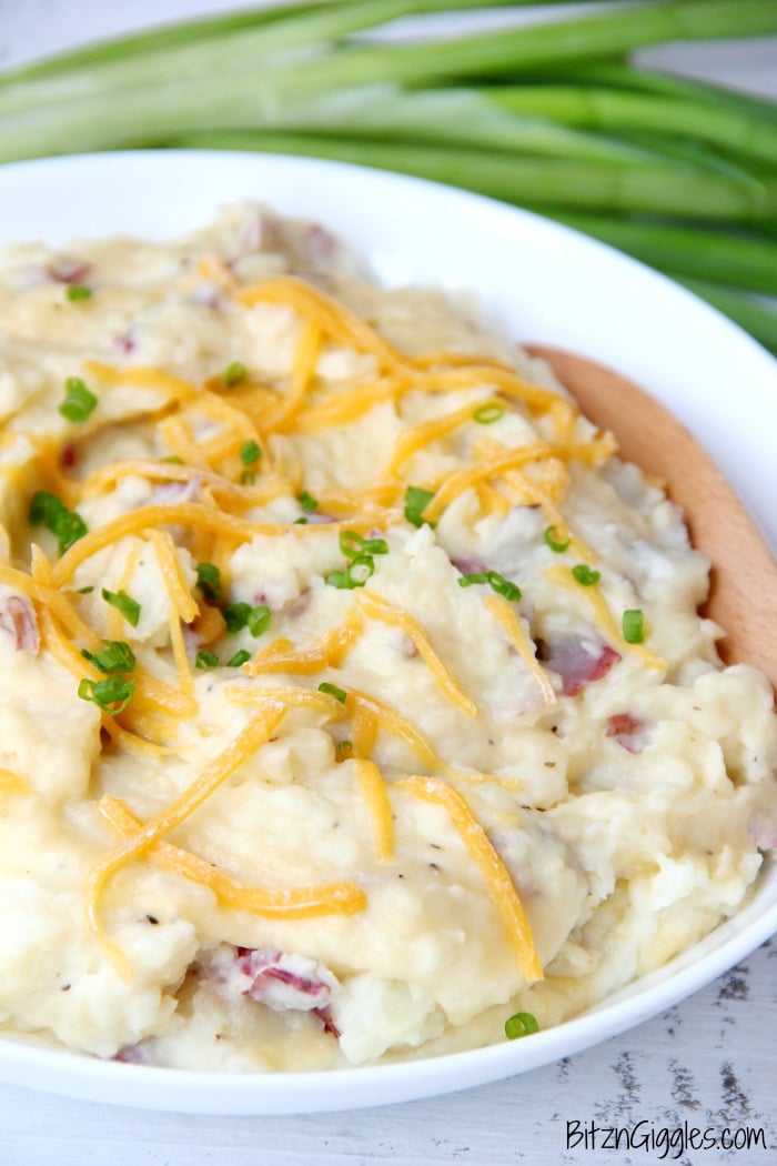 Twice Baked Red Potato Casserole - Flavorful mashed potatoes you bake right in the oven!! Perfect for a crowd!