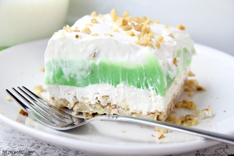 Pistachio pie bar on plate with fork.
