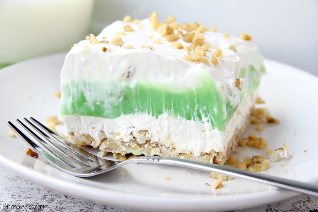 Pistachio Pie Bars - Creamy, four-layer bars with a pie-like crust topped with cheesecake and pistachio deliciousness!