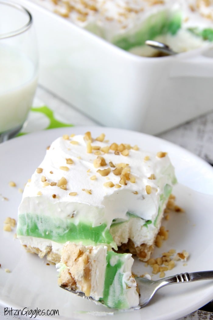 Pistachio Pie Bars - Creamy, four-layer bars with a pie-like crust topped with cheesecake and pistachio deliciousness!