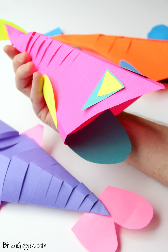 Slinky Fish Craft - All you need is construction paper, scissors and glue stick for this fun and colorful kids craft! The slinky "cut" makes the fish flexible almost like it's swimming!