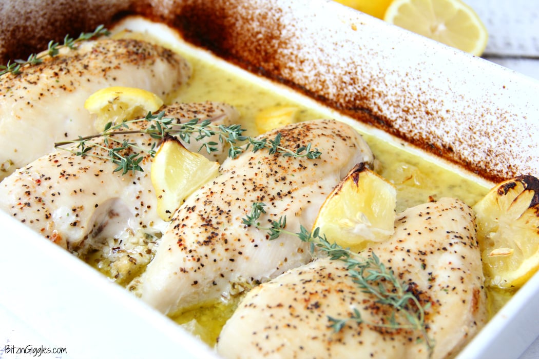 Easy Lemon Chicken - Juicy and tender chicken breasts baked in a lemon-herb sauce brimming with delicious lemony flavor!