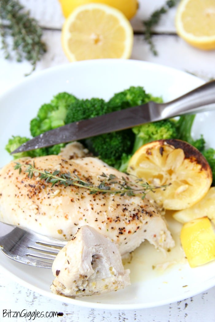 Easy Lemon Chicken - Juicy and tender chicken breasts baked in a lemon-herb sauce brimming with delicious lemony flavor!