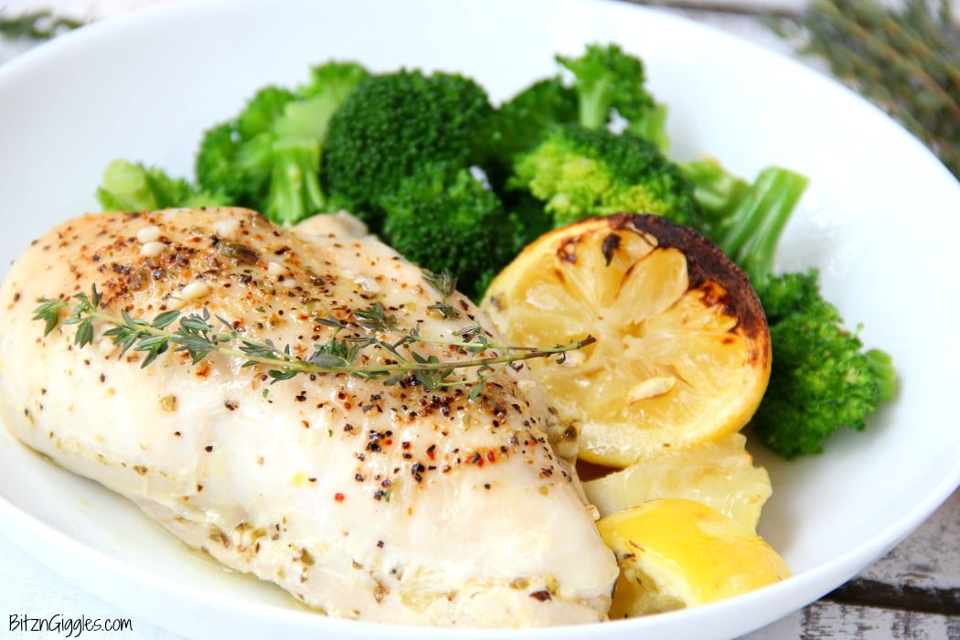 Easy Lemon Chicken - Juicy and tender chicken breasts baked in a lemon-herb sauce brimming with delicious lemony flavor!