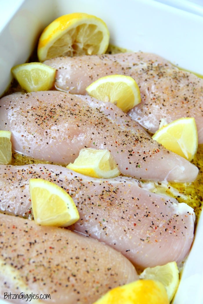 Easy Lemon Chicken - Juicy and tender chicken breasts baked in a lemon-herb sauce brimming with delicious lemony flavor!