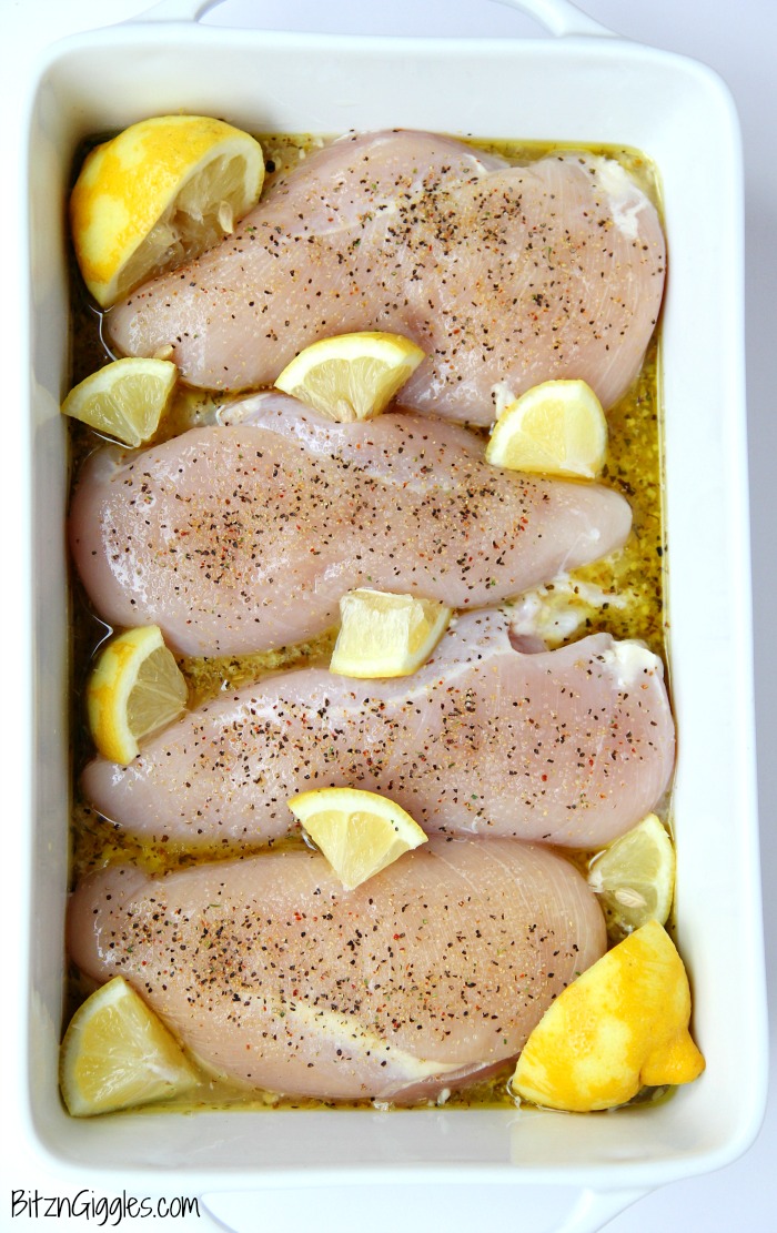 Easy Lemon Chicken - Juicy and tender chicken breasts baked in a lemon-herb sauce brimming with delicious lemony flavor!