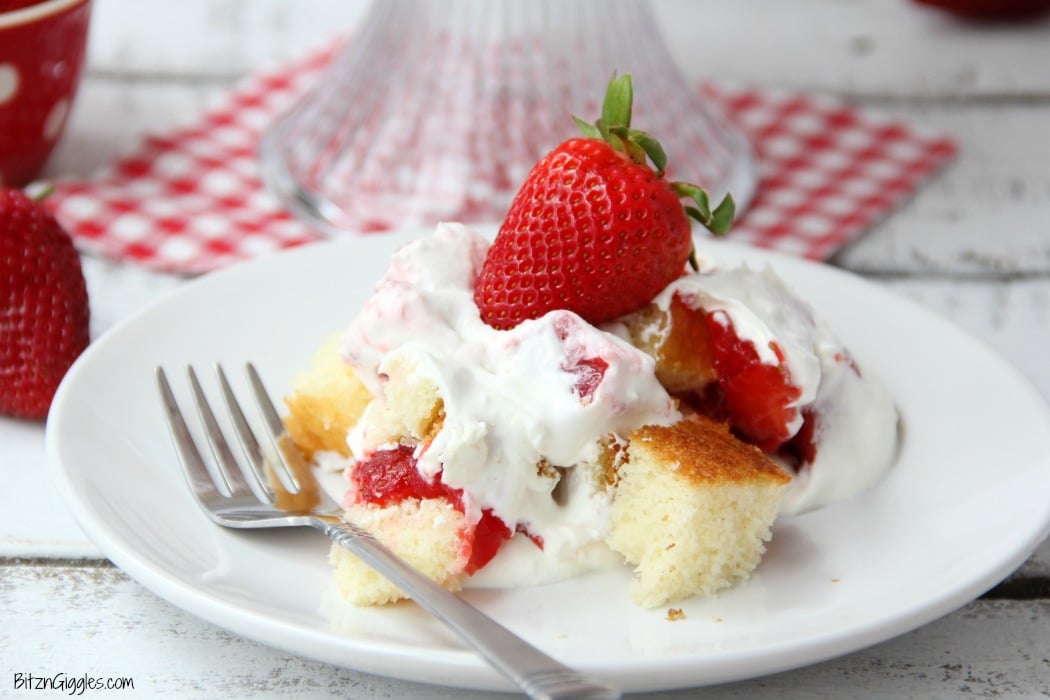 Strawberry Shortcake Trifle - A beautiful and delicious trifle layered with vanilla cake, homemade strawberry glaze and cream! Such a pretty dessert!