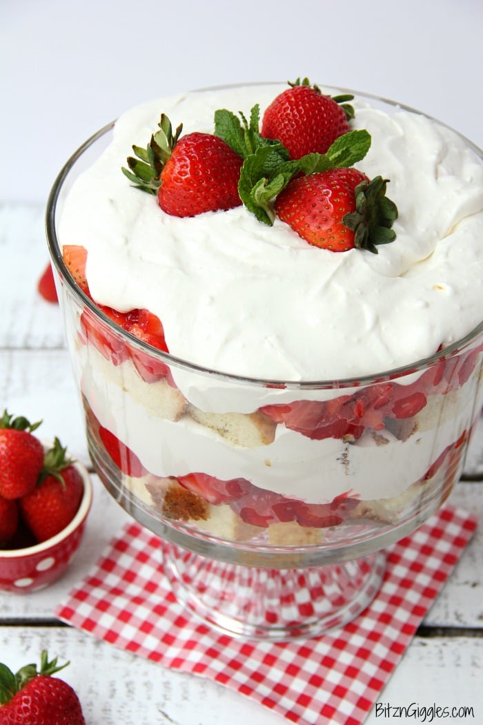 Strawberry Shortcake Trifle - A beautiful and delicious trifle layered with vanilla cake, homemade strawberry glaze and cream! Such a pretty dessert!