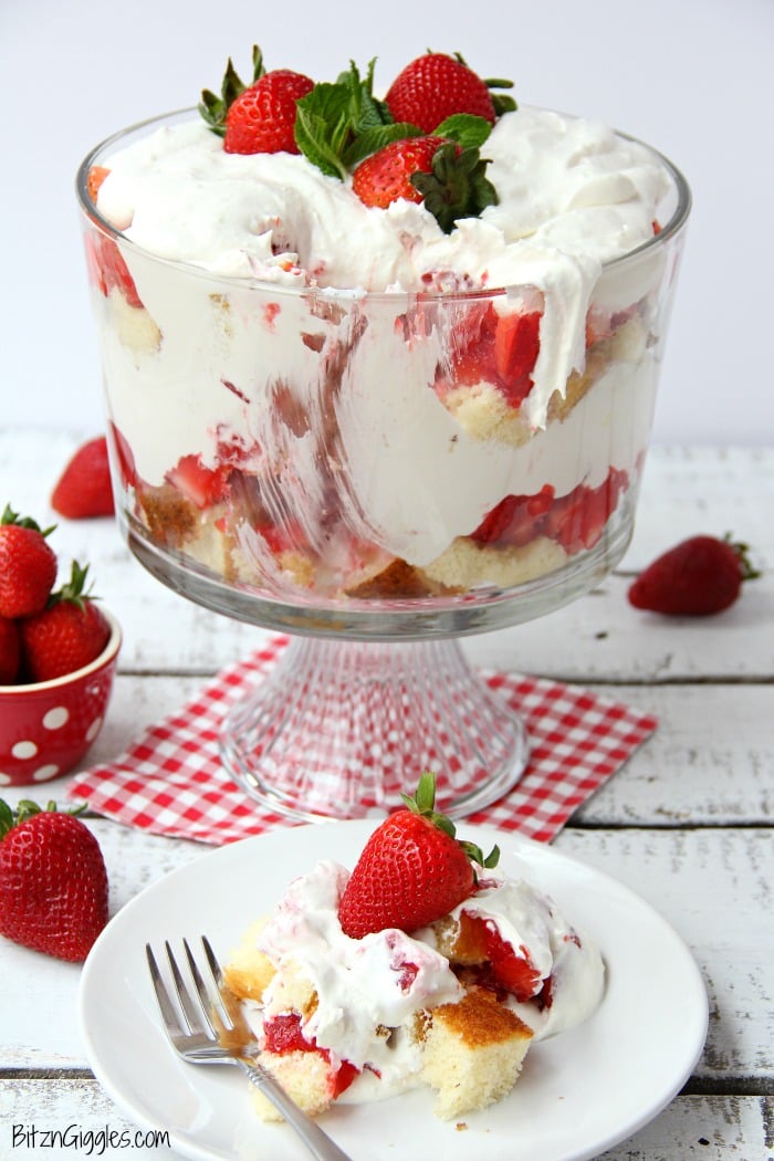 Strawberry Shortcake Trifle - A beautiful and delicious trifle layered with vanilla cake, homemade strawberry glaze and cream! Such a pretty dessert!