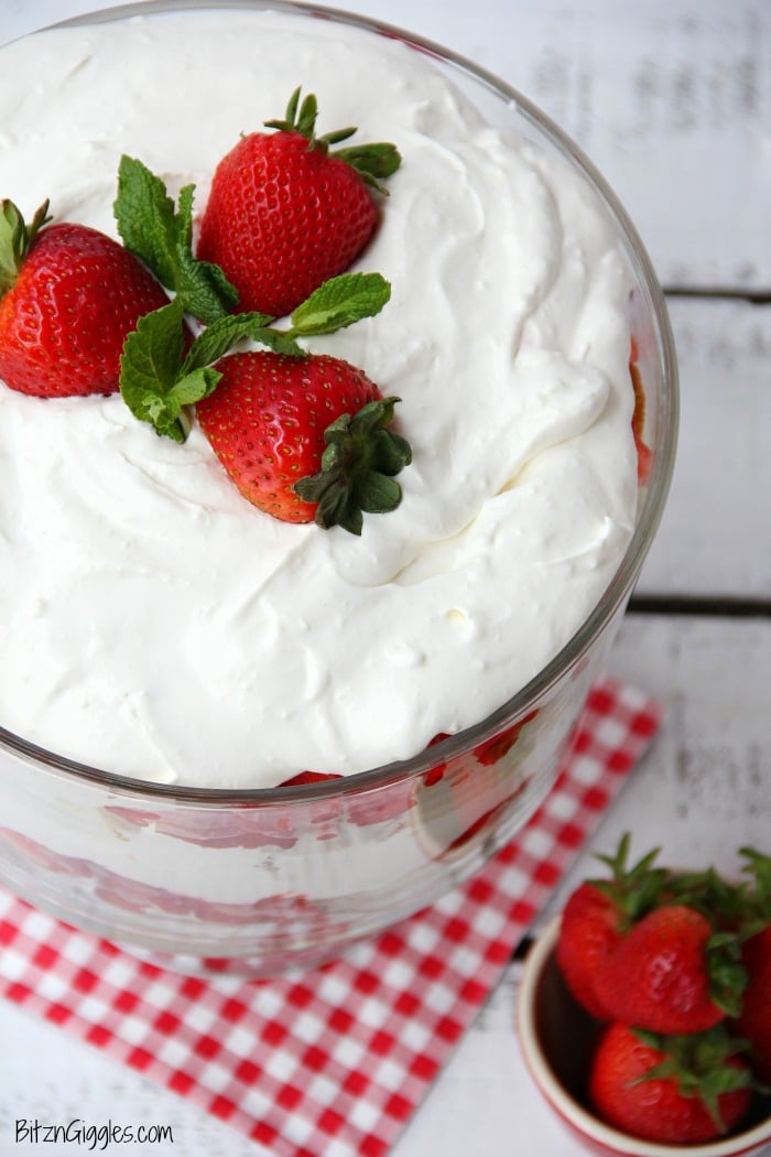 Strawberry Shortcake Trifle - A beautiful and delicious trifle layered with vanilla cake, homemade strawberry glaze and cream! Such a pretty dessert!