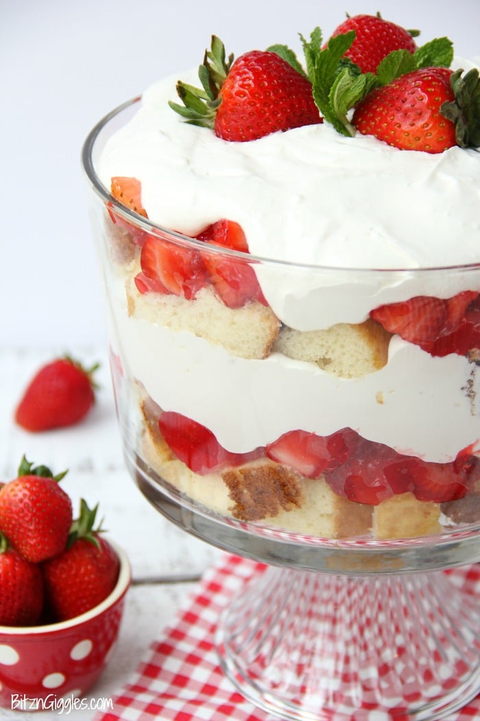 Strawberry Shortcake Trifle - A beautiful and delicious trifle layered with vanilla cake, homemade strawberry glaze and cream! Such a pretty dessert!