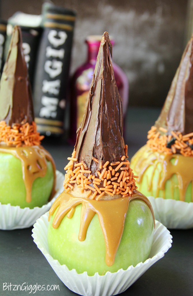Witchy Caramel Apples - Crisp and tart Granny Smith apples covered with melted caramel and topped with a chocolate covered sugar cone garnished with some Halloween-themed sprinkles.