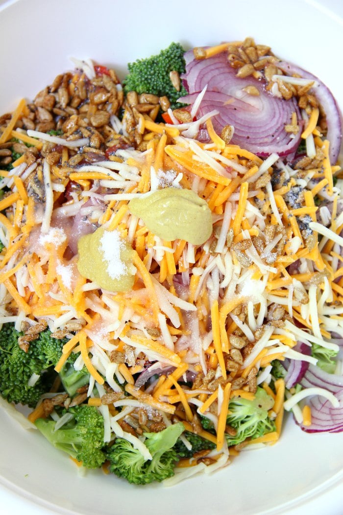 Broccoli and Tomato Salad - Sweet grape tomatoes, red onion, broccoli, cheese and sunflower seeds drizzled with a tangy raspberry vinaigrette.