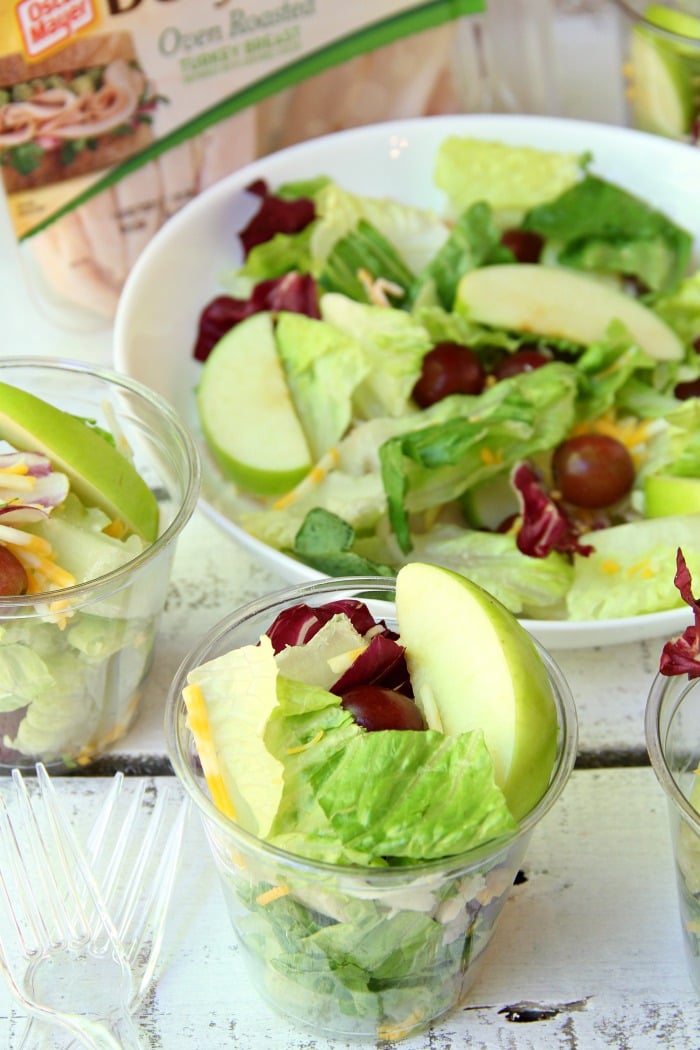 Harvest Salad to Go - A delicious combination of granny smith apples, grapes, cheese, bacon bits and more make this a perfect addition to any party menu! Serve in cups for easy and convenient eating!