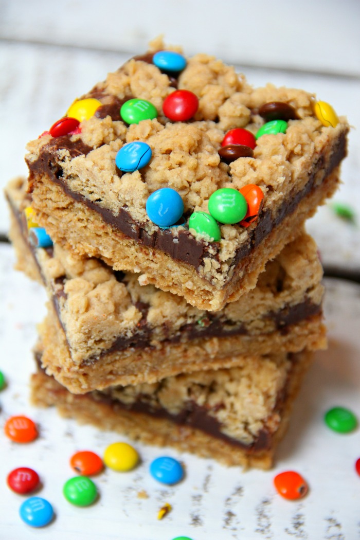 M&M Chocolate Oatmeal Bars - Chewy oatmeal bars with a chocolaty fudge layer, sprinkled with M&Ms.