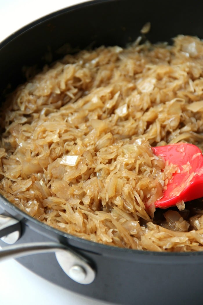 Sausage Potato Sauerkraut Skillet - Kielbasa, potatoes and Coca Cola infused sauerkraut creates a winning combination for a traditional and comforting skillet meal.