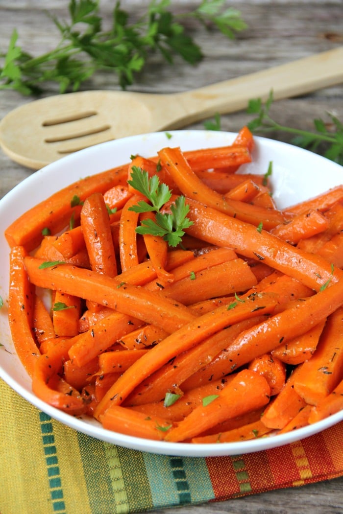 Maple Dijon Glazed Carrots - Sweet, roasted carrots with a delicious maple dijon glaze! Perfect for the holidays!