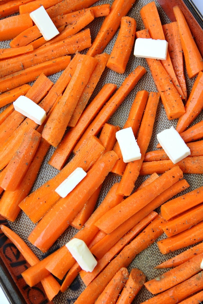 Maple Dijon Glazed Carrots - Sweet, roasted carrots with a delicious maple dijon glaze! Perfect for the holidays!