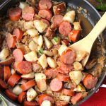 Sausage Potato Sauerkraut Skillet - Kielbasa, potatoes and Coca Cola infused sauerkraut creates a winning combination for a traditional and comforting skillet meal.