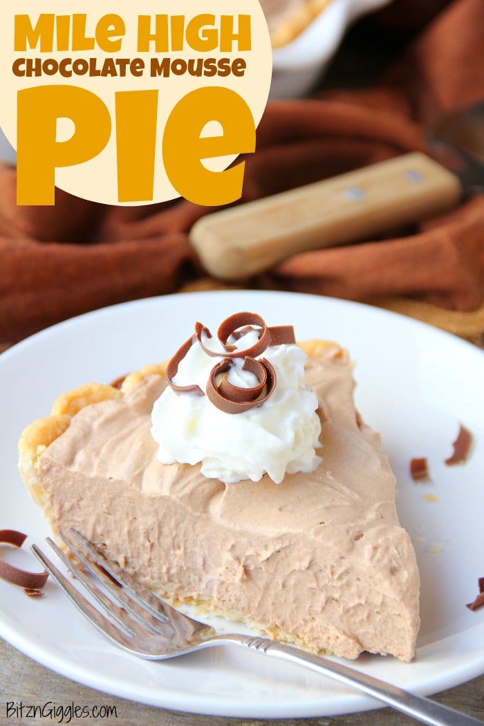 Mile High Chocolate Mousse Pie - Creamy, decadent chocolate mousse piled high and finished off with whipped cream and chocolate shavings.