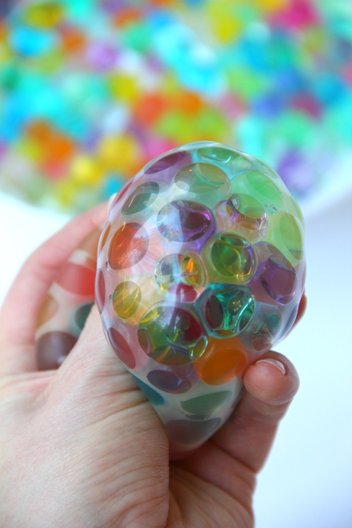 Water Bead Stress Ball - A transparent balloon filled with colorful water beads makes for a soothing and fun kids toy or stress reliever!