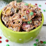 Christmas Crunch Snack Mix - An addicting combination of sweet and salty deliciousness enveloped in decadent white chocolate!