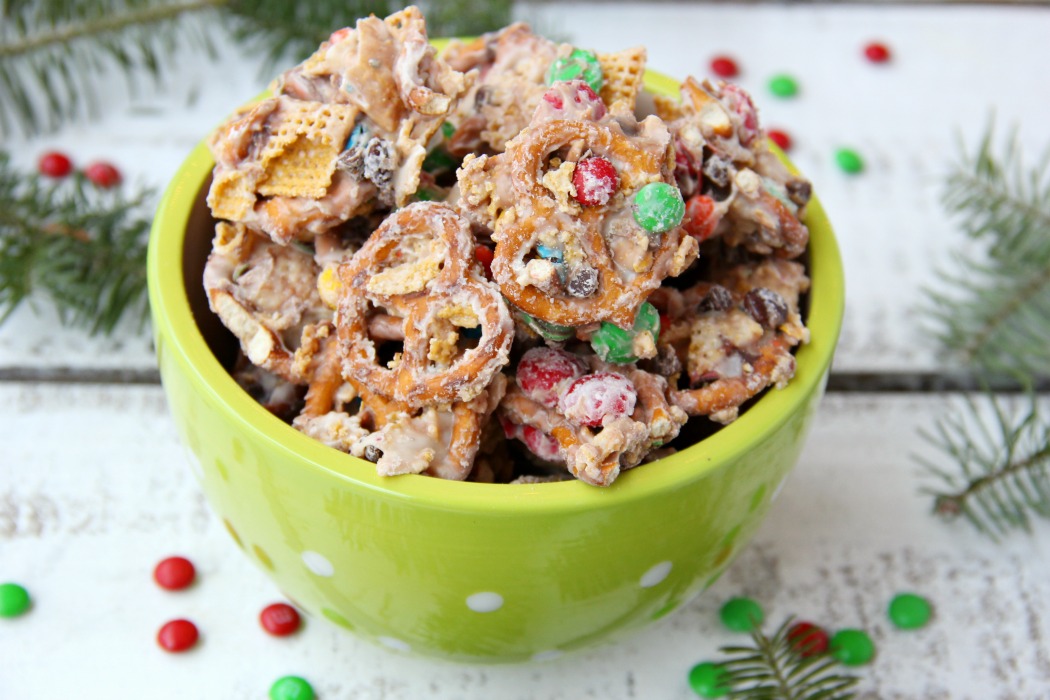 Christmas Crunch Snack Mix - An addicting combination of sweet and salty deliciousness enveloped in decadent white chocolate!