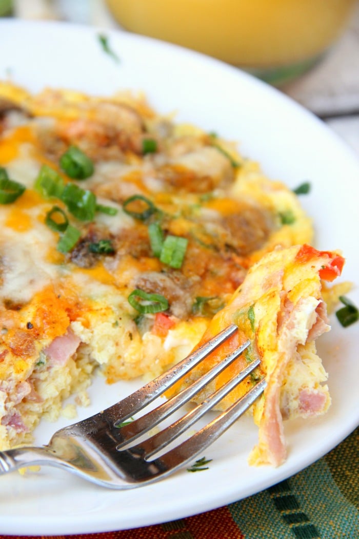 Easy Air Fryer Omelette - Prepared in the air fryer and filled with fresh veggies and cheese, this omelette is delicious and ready in 6 minutes!