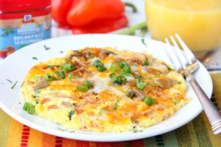 Easy Air Fryer Omelette - Prepared in the air fryer and filled with fresh veggies and cheese, this omelette is delicious and ready in 6 minutes!