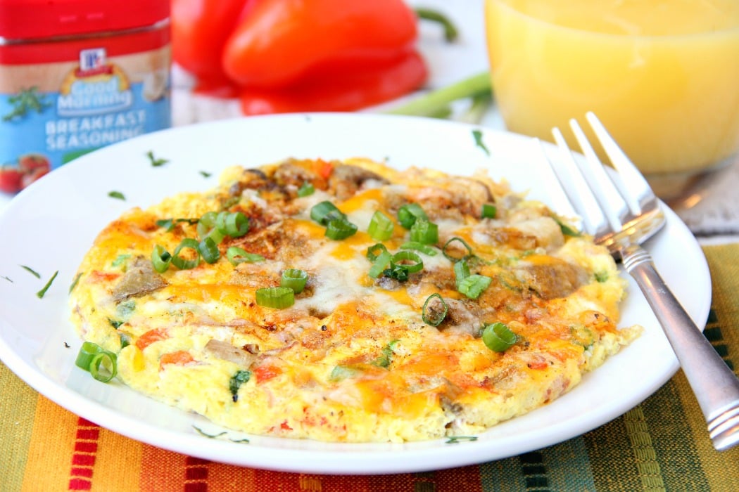 Easy Air Fryer Omelette - Prepared in the air fryer and filled with fresh veggies and cheese, this omelette is delicious and ready in 6 minutes!