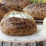 Easy Air Fryer Baked Potatoes - Tender, delicious baked potatoes with a crispy, flavorful skin. You'll never go back to microwaving or baking in the oven again!