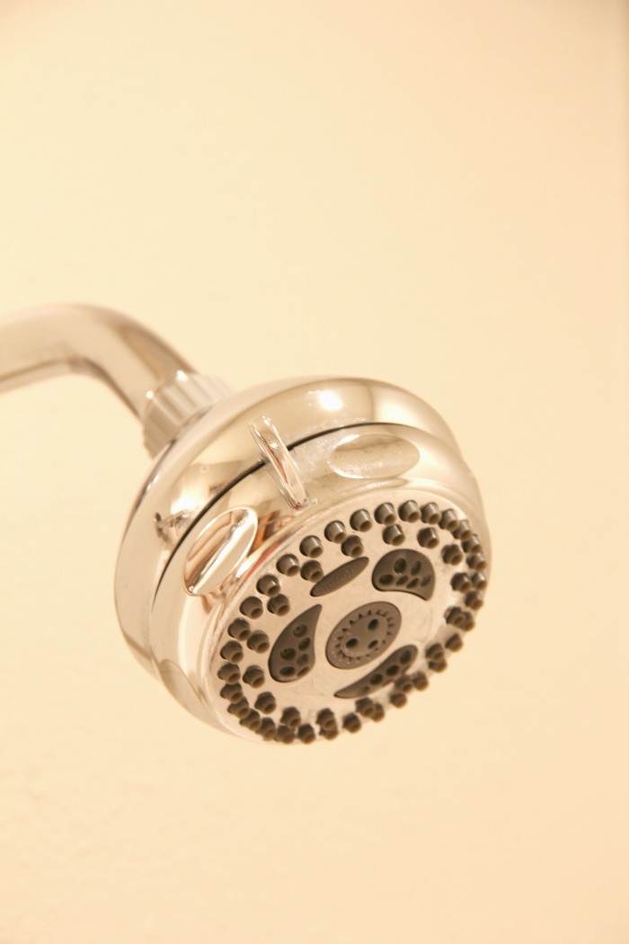 How to Clean a Shower Head - If you have a gross and grimy shower head, this simple homemade solution is sure to make it look like new again!