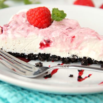 Swirled Raspberry Cheesecake -A fluffy Oreo-crust cheesecake with decadent raspberry swirls.