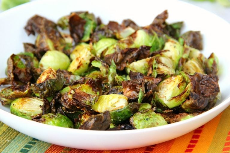 White bowl filled with air fryer Brussels sprouts.