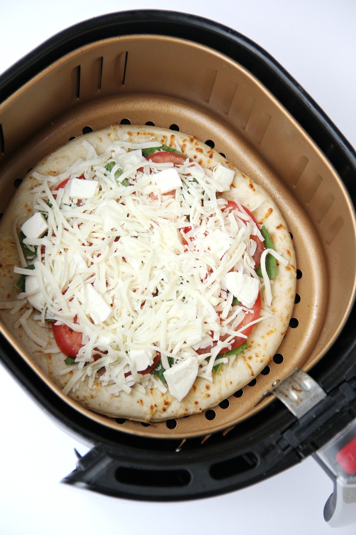 Air Fryer Pizza - Crispy and flavorful pizza baked right in the air fryer!